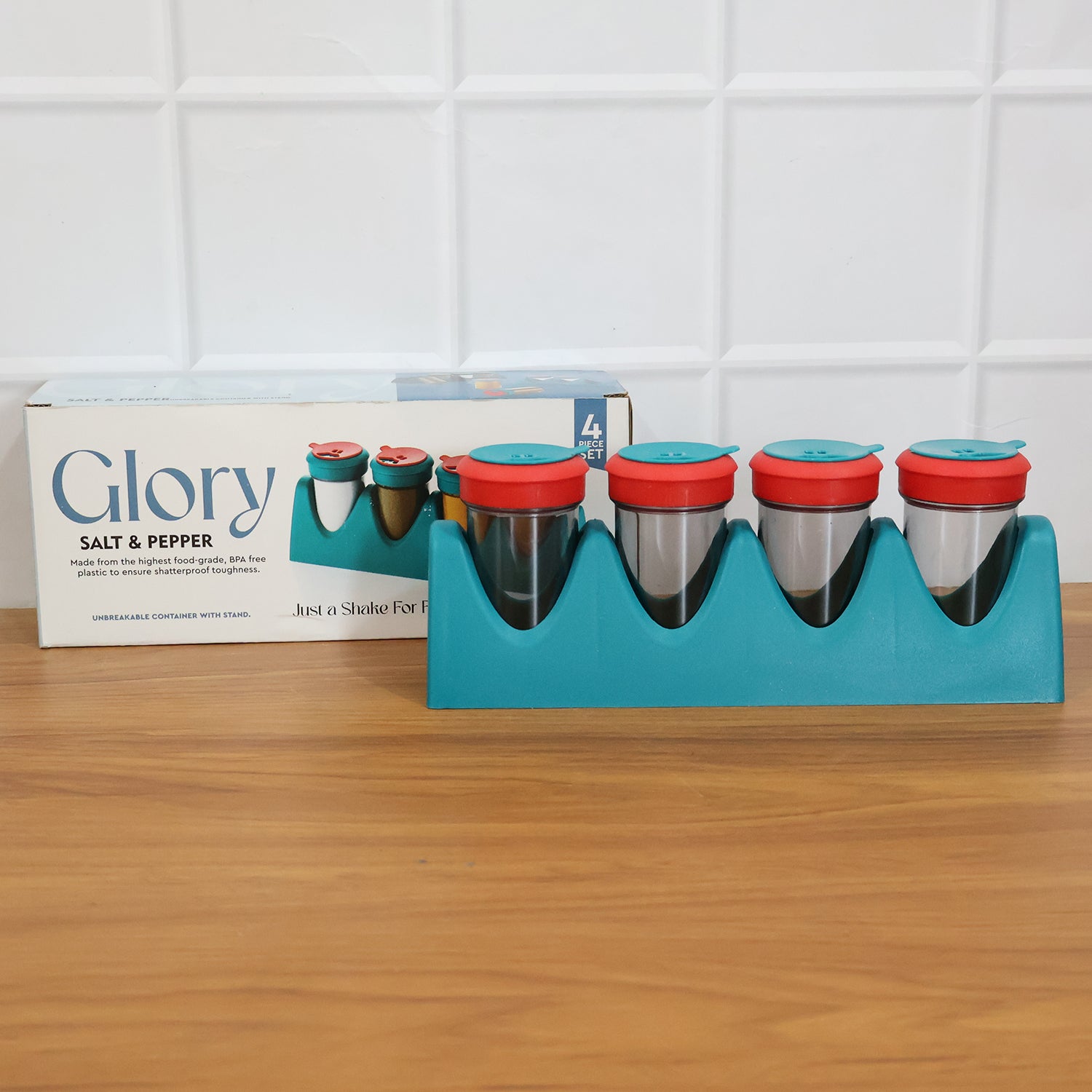 Wukusy 4-in-1 multipurpose spice shaker set with four compartments for salt, pepper, and spices, featuring clear containers and lids.