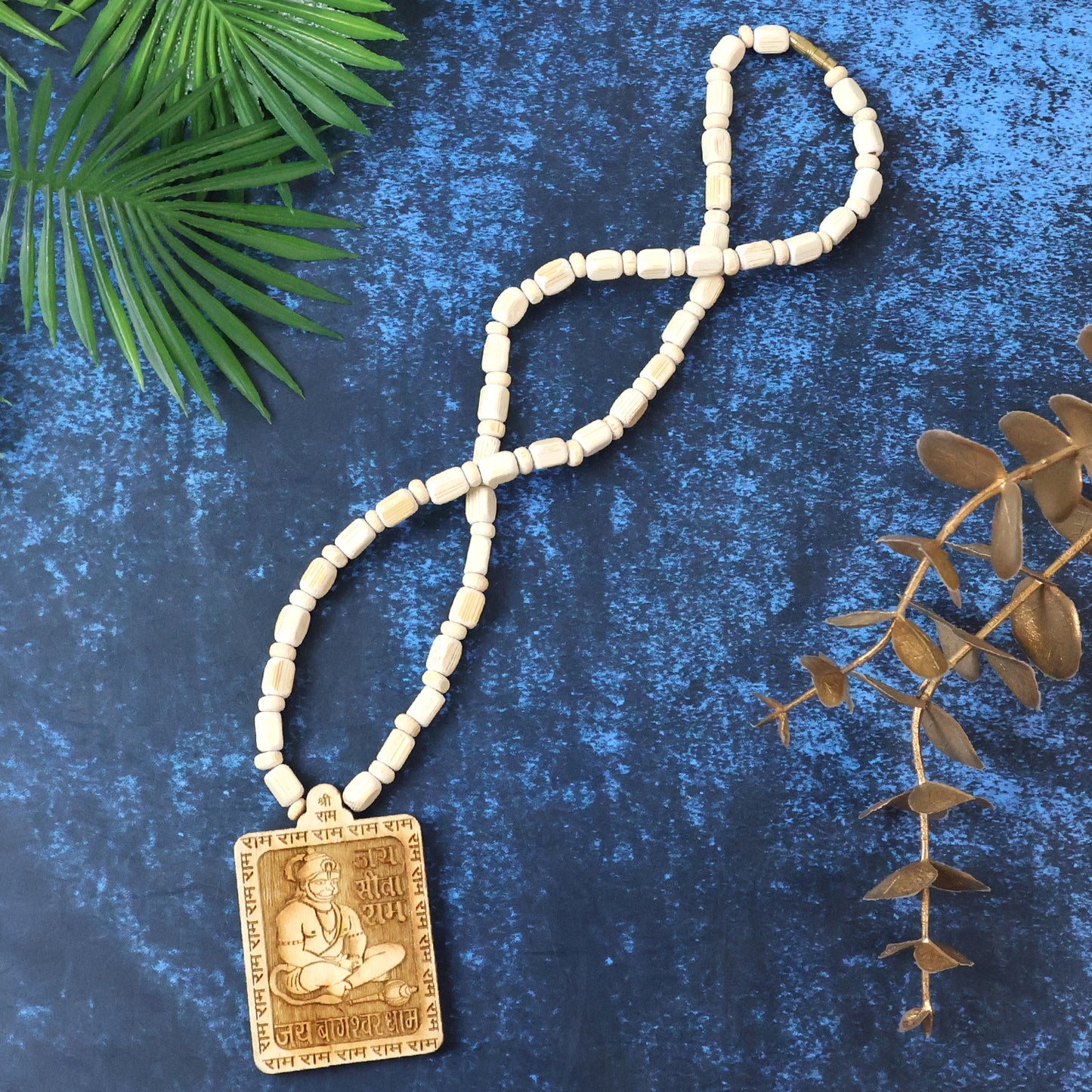 Wooden Hanuman pendant mala from Wukusy, featuring intricately carved deity charm and wooden beads, traditional spiritual jewelry.