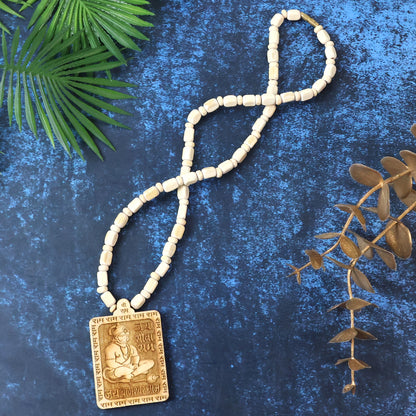 Wooden Hanuman pendant mala from Wukusy, featuring intricately carved deity charm and wooden beads, traditional spiritual jewelry.