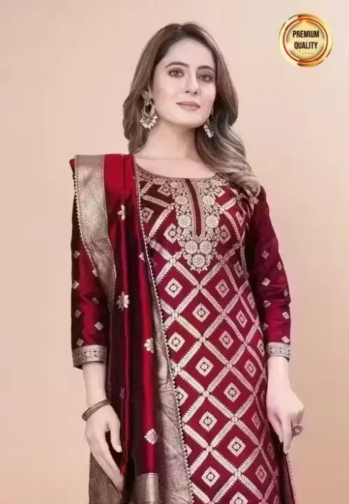 Elegant women’s salwar suit from Ekom's party wear collection, featuring art silk with zari weaving and unstitched set.