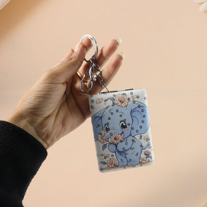 Wukusy foldable mirror keychain toy featuring a compact, portable design with a reflective surface and colorful exterior.