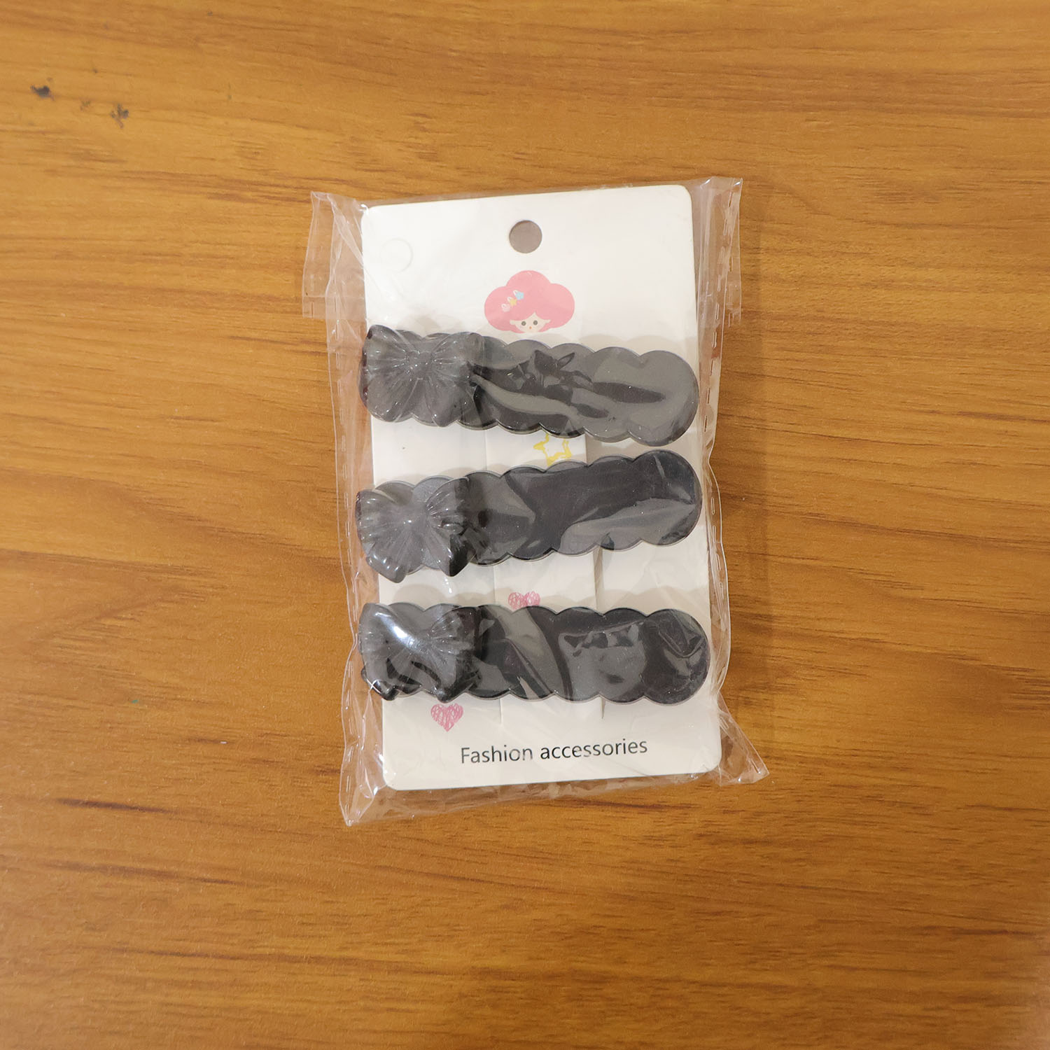 Set of three black bow hair clips by Wukusy, decorative accessories for elegant hair styling.