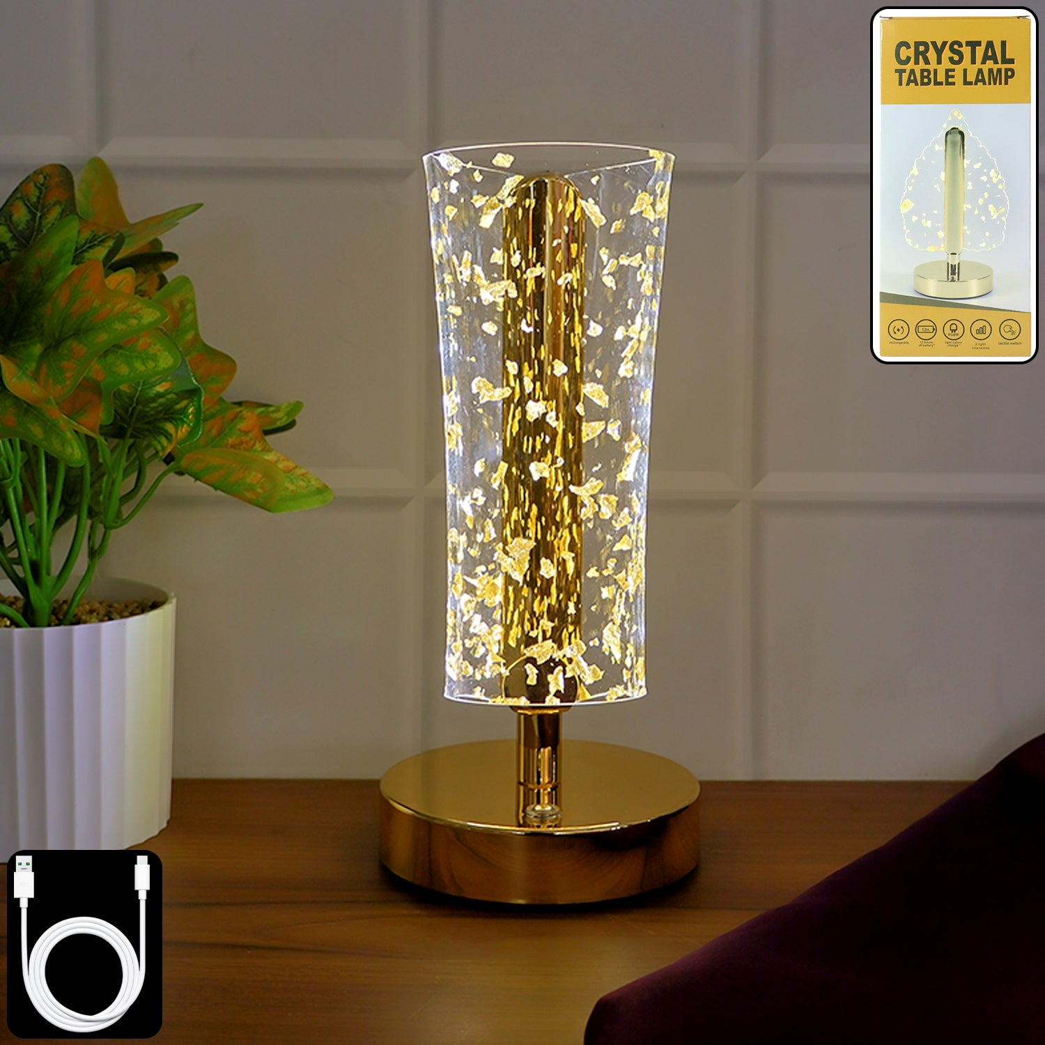 Luxury golden crystal LED table lamp by Wukusy with a sleek design and illuminated crystal accents on a modern table surface.
