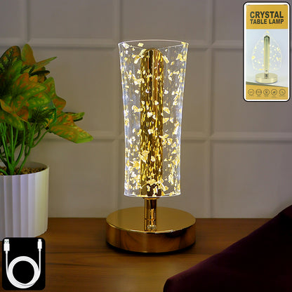 Luxury golden crystal LED table lamp by Wukusy with a sleek design and illuminated crystal accents on a modern table surface.