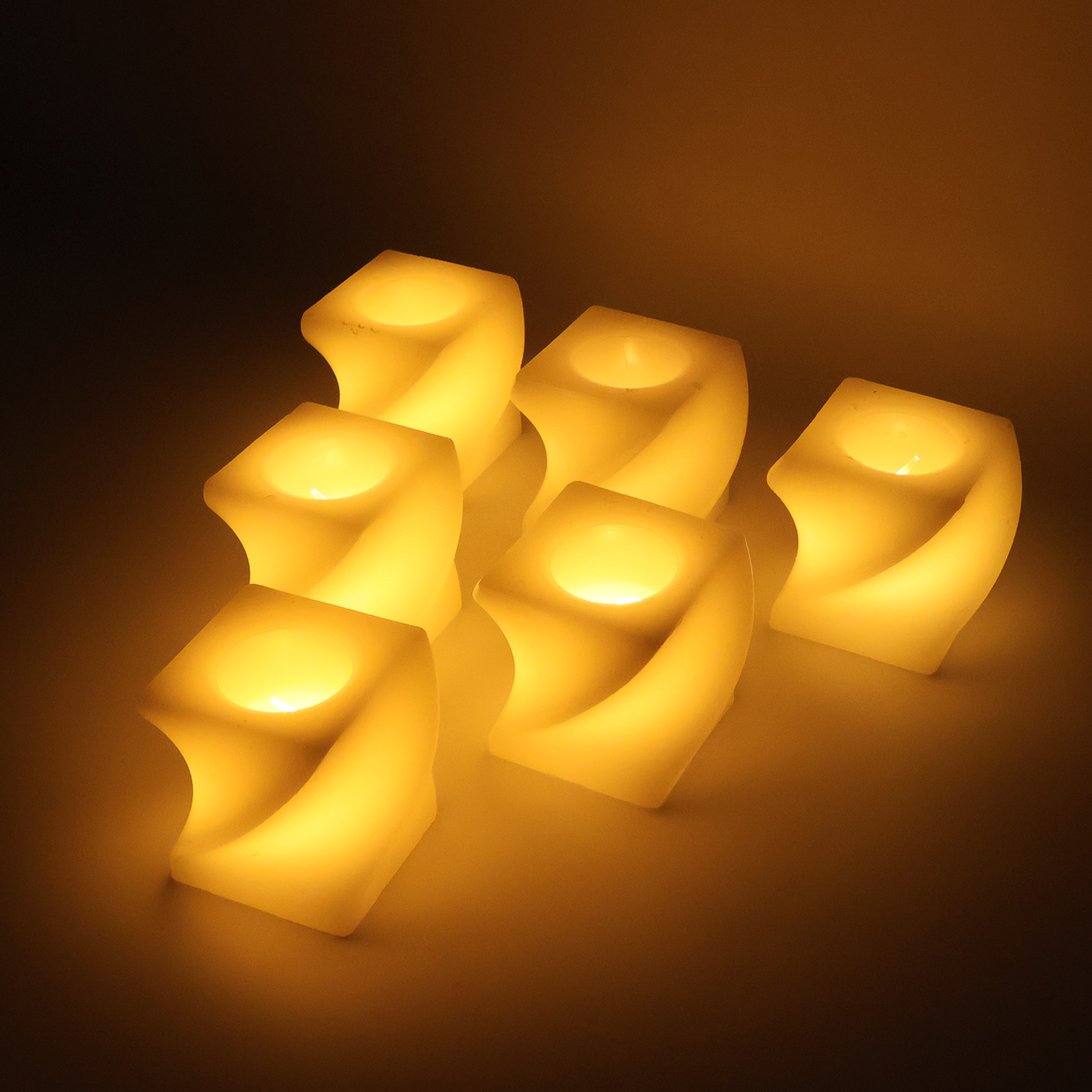 Set of 6 Wukusy LED flameless square decorative candles, tealight lamps for home decor, soft glowing ambiance.