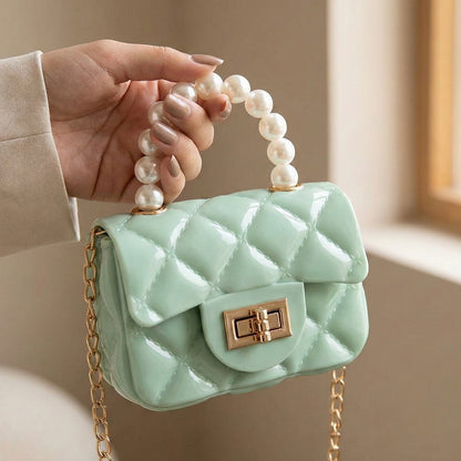 Wukusy elegant quilted mini handbag with a sling strap, compact fashion accessory for casual or formal wear.