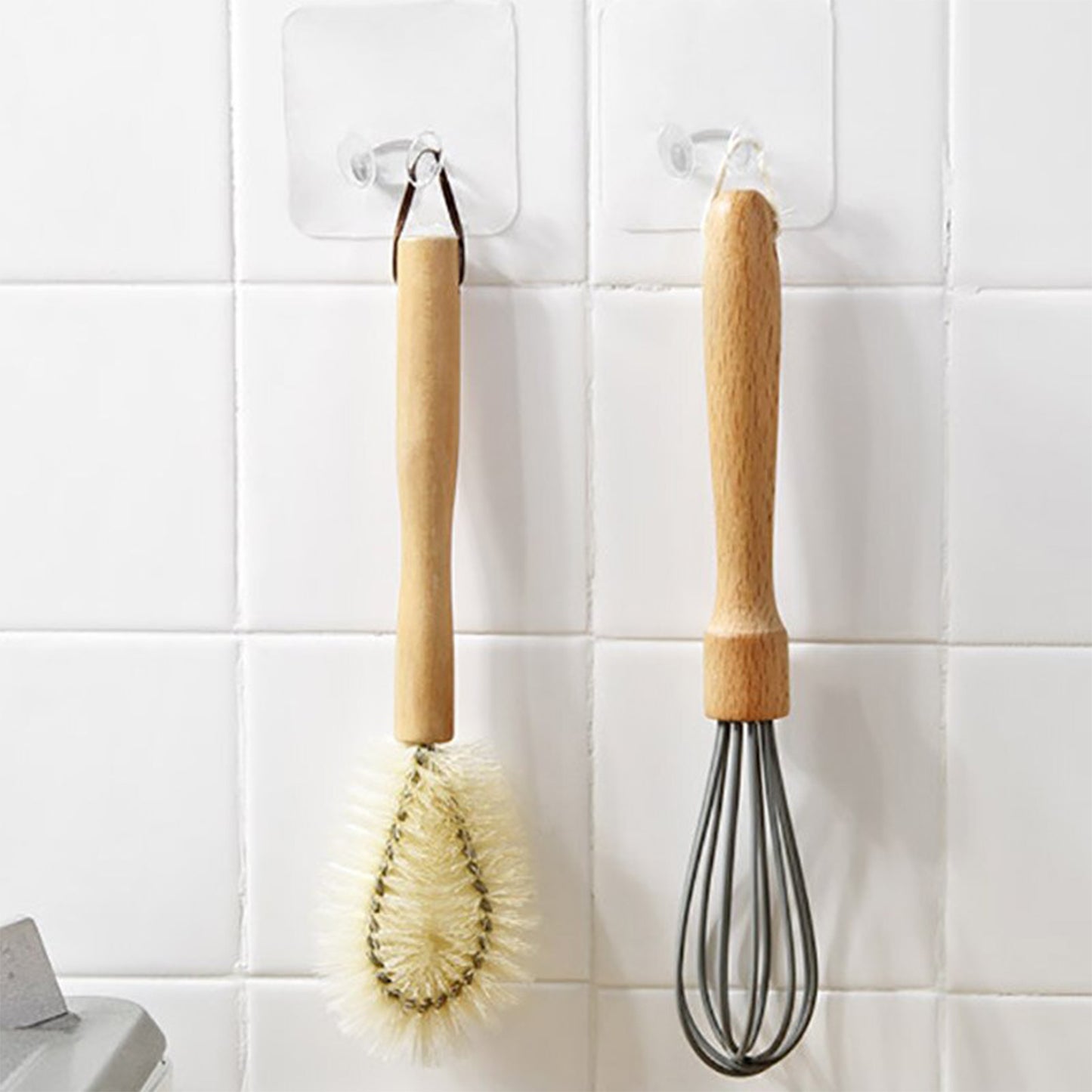 Wukusy 4861 transparent multi-function wall storage hooks mounted on a wall for home organization and hanging items.