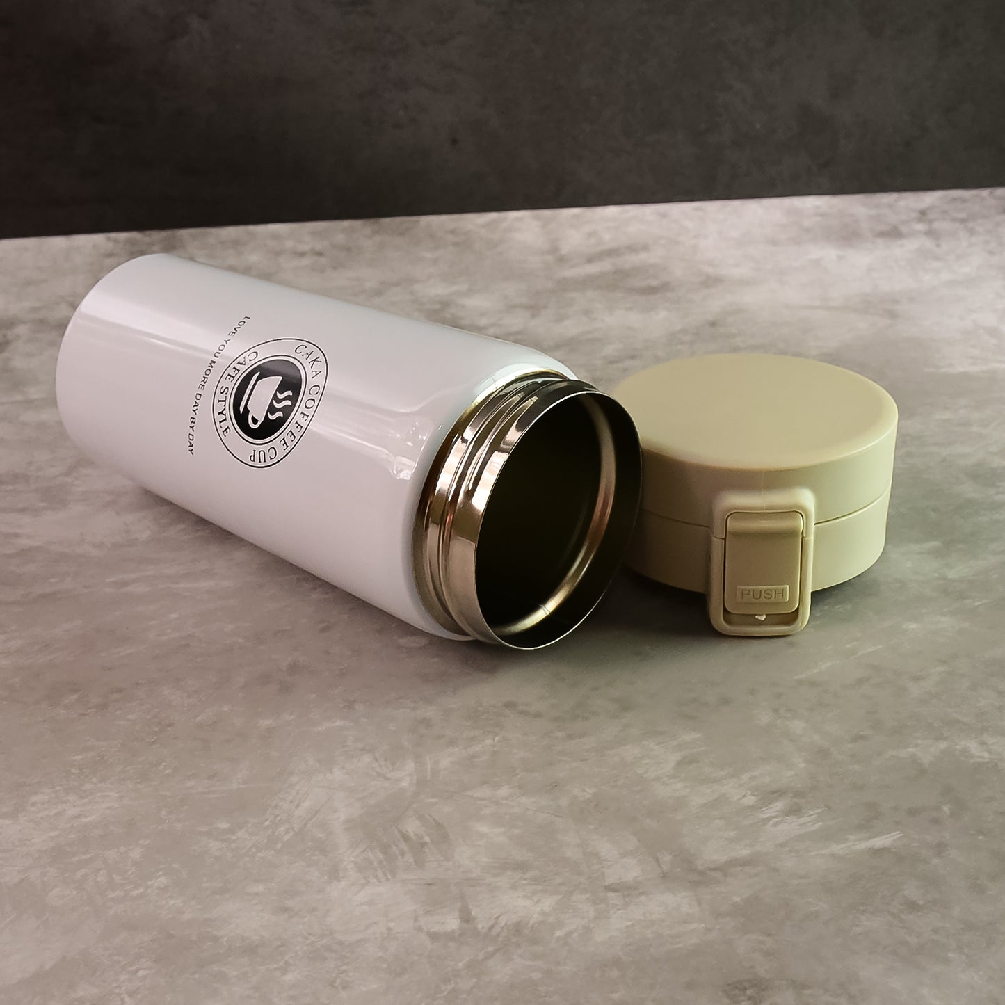 Wukusy stainless steel vacuum insulated coffee flask with flip lock lid, 400ml, showing the sleek stainless steel design.