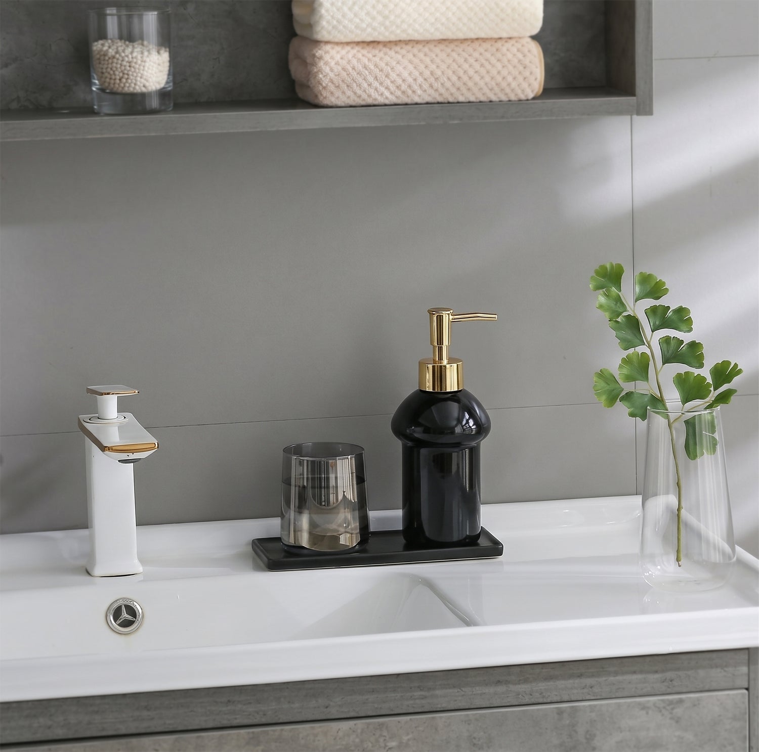 Black glass liquid soap dispenser bottle with gold pump from Wukusy, refillable and stylish for bathroom or kitchen use.
