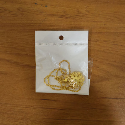 Gold plated pendant necklace by Wukusy featuring an elegant floral design on a delicate chain.