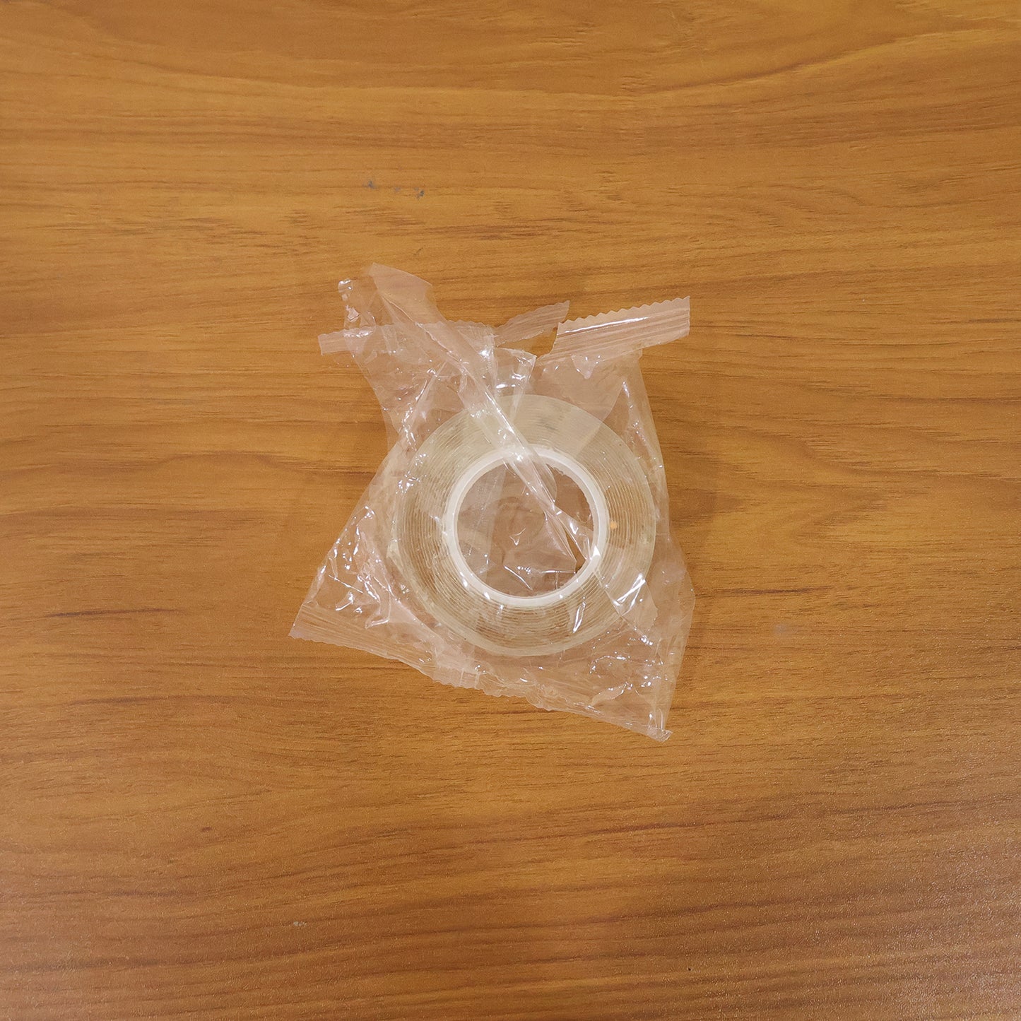 Heavy duty transparent double-sided nano adhesive tape by Wukusy, 70x25mm, showing the tape applied for strong mounting.