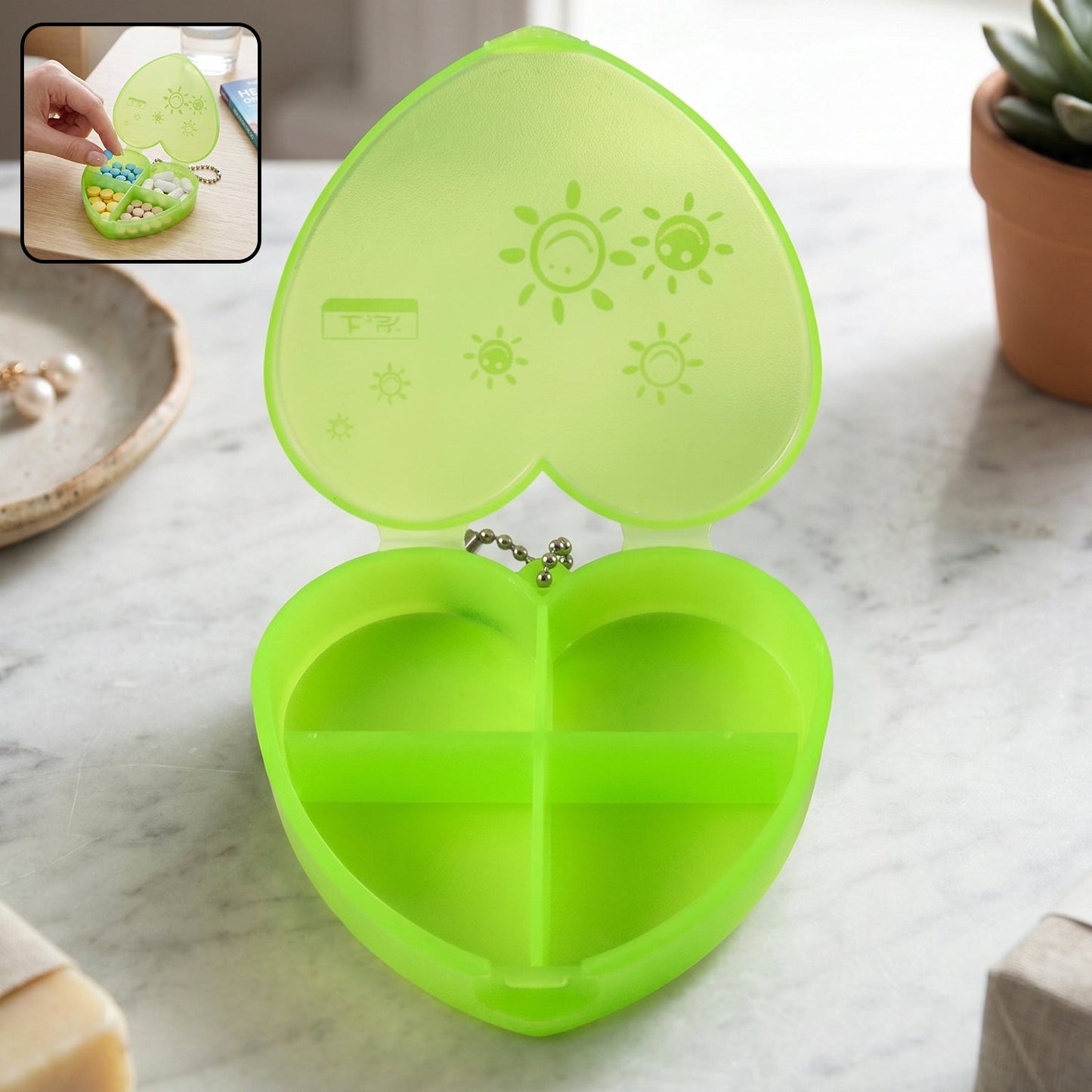 Wukusy plastic heart-shaped pill organizer with four compartments and keychain for portable medication storage.