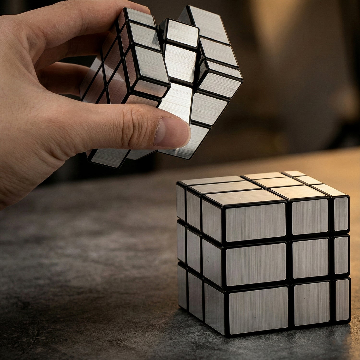 Wukusy Mirror Cube 3x3 puzzle toy with reflective silver surfaces, showcasing its shiny, metallic finish and intricate internal mechanism.