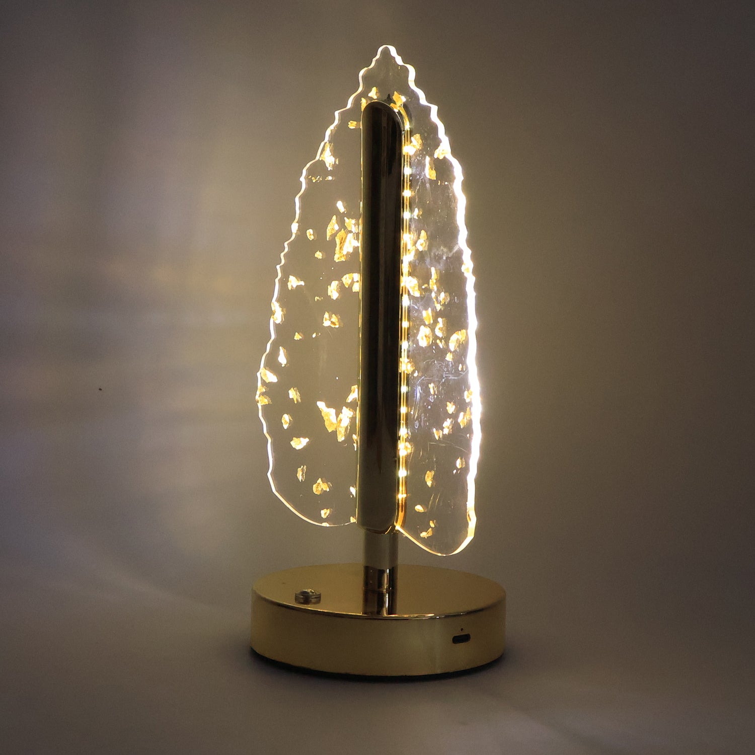 Golden crystal leaf-shaped LED table lamp by Wukusy, elegant home decor piece with warm lighting and intricate leaf design.