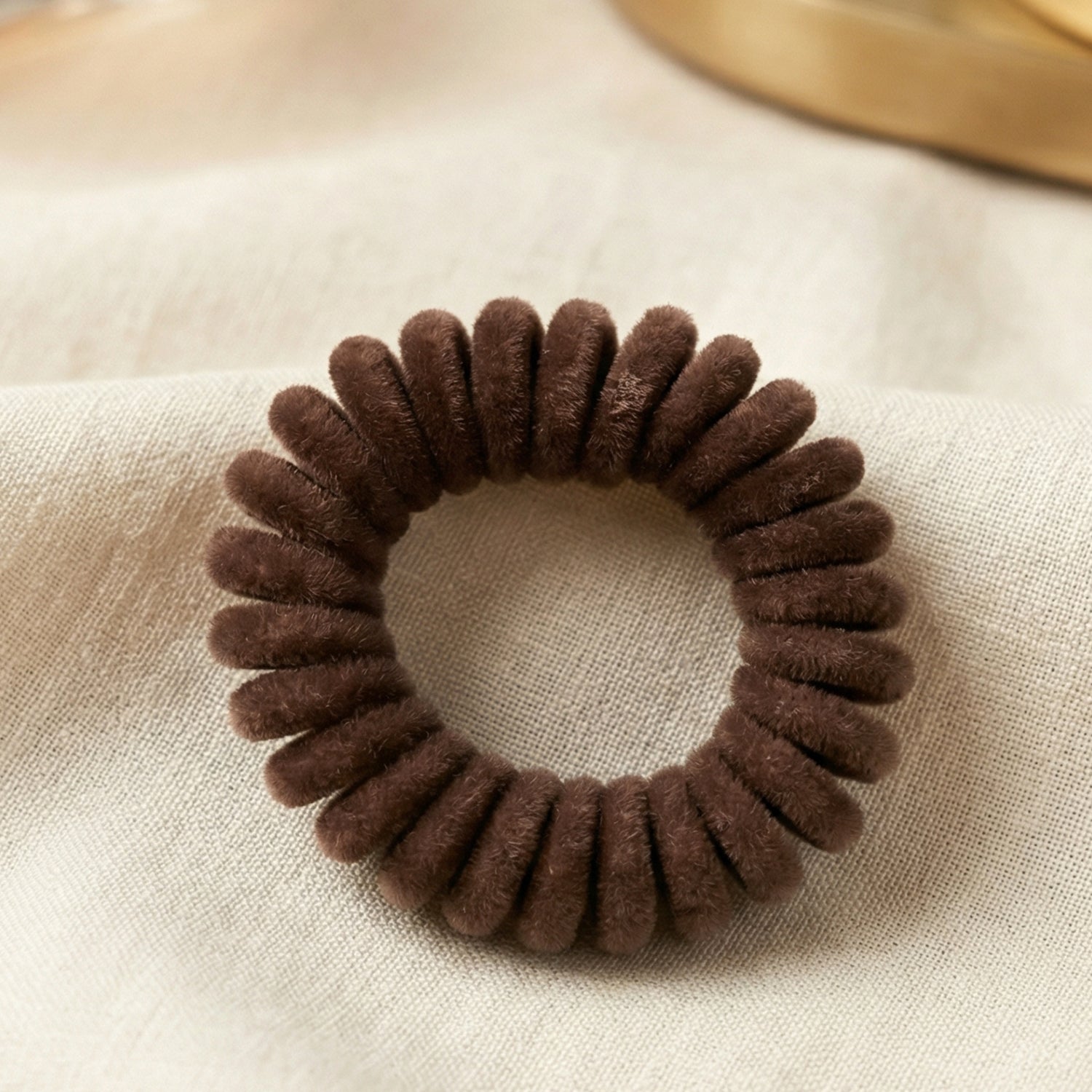 Soft stretchable telephone wire style hair band from Wukusy, shown in black, with a flexible, thin, and durable design for hair styling.