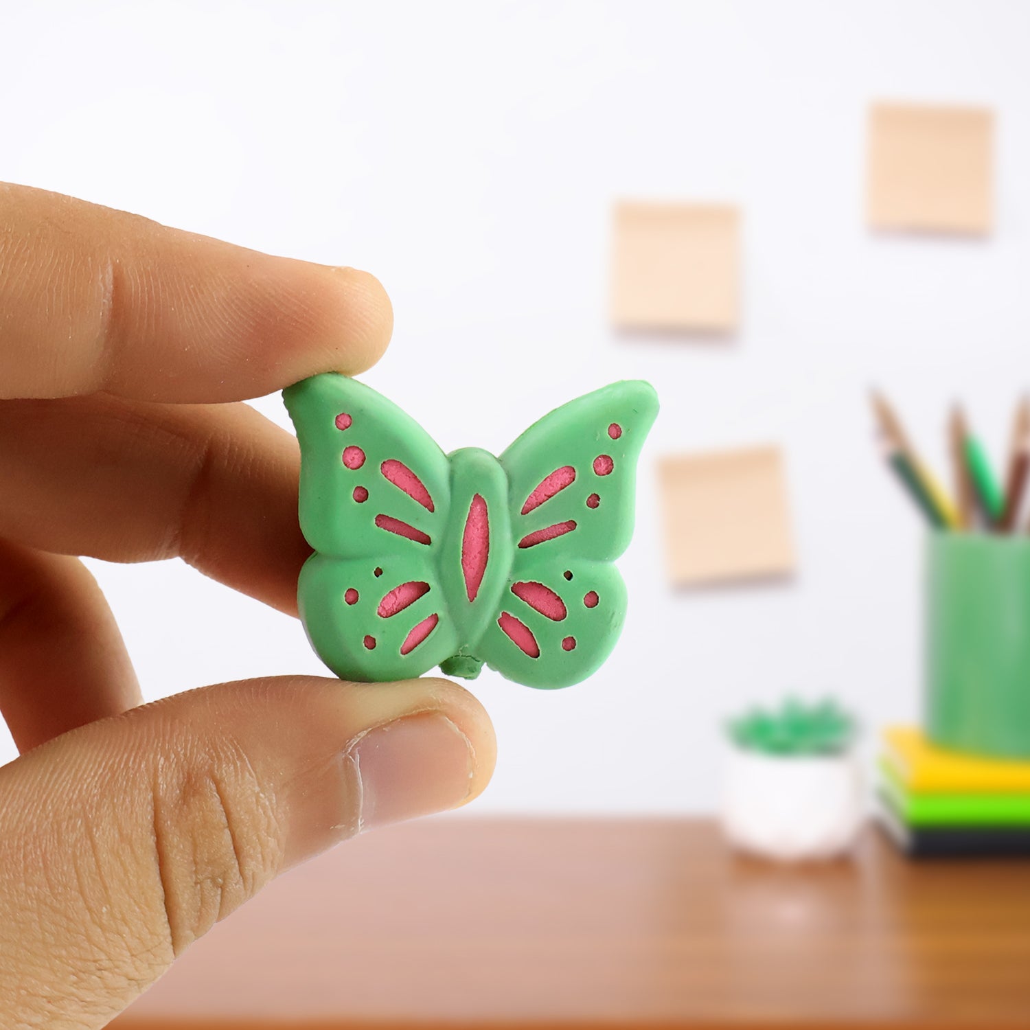 Set of 25 colorful butterfly shape rubber erasers by Wukusy, ideal for office or school use, with vibrant mixed colors and butterfly designs.