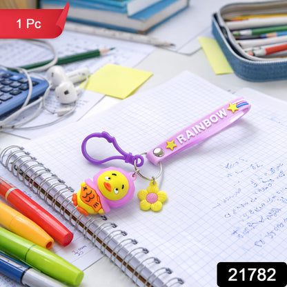 Cute rainbow strap cartoon duck keychain by Wukusy hanging on a keyring with colorful details.