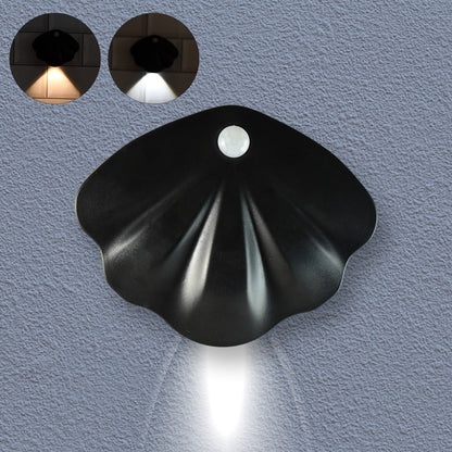 Shell-shaped Wukusy motion sensor night light for home decor, featuring a soft glow and decorative shell design.