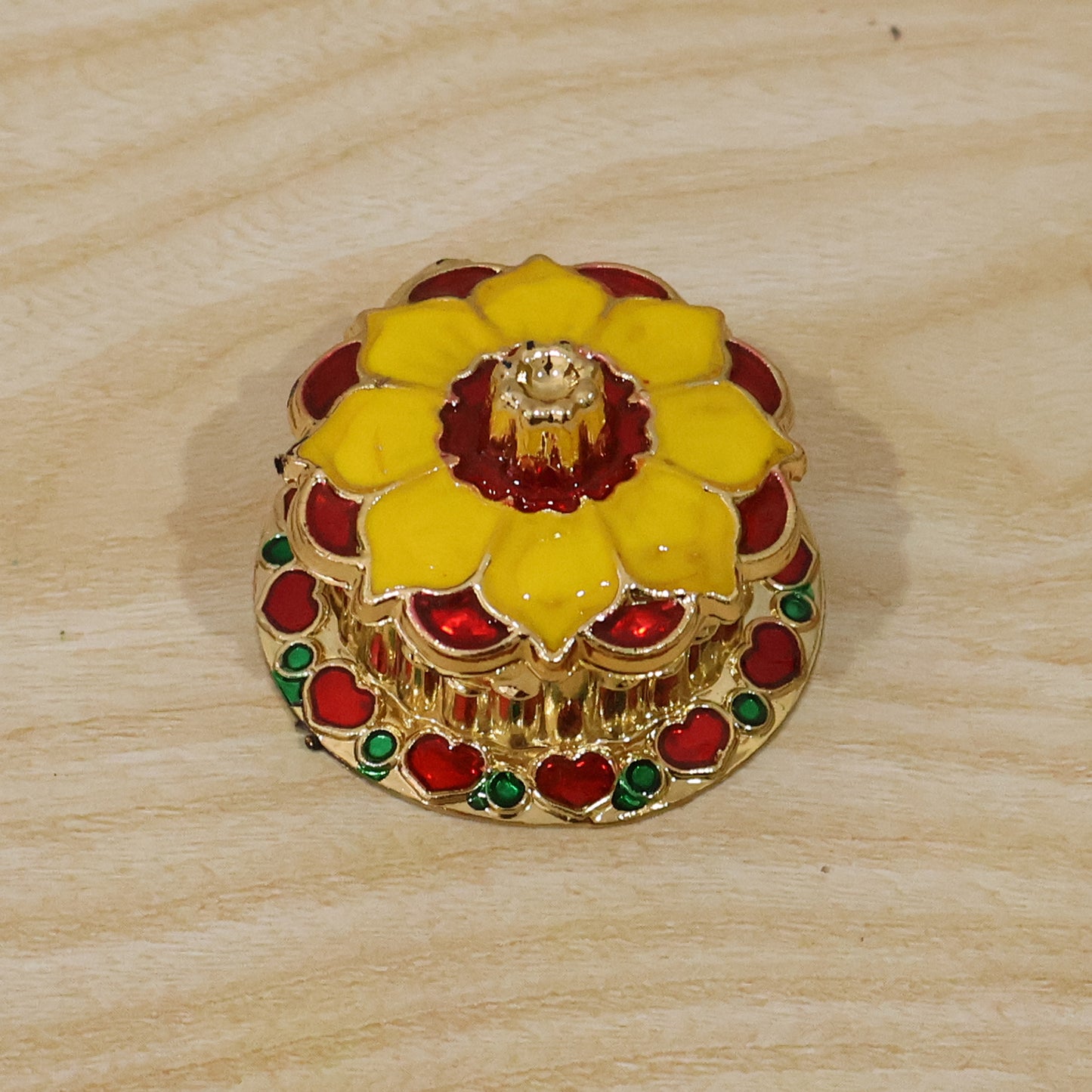 Decorative golden Kankavati Kumkum box for sindoor, traditional pooja accessory, by Wukusy, featuring intricate design and compact size.