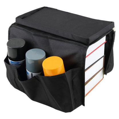 Black Wukusy sofa arm rest hanging storage bag holding magazines, iPad, and books for easy organization.