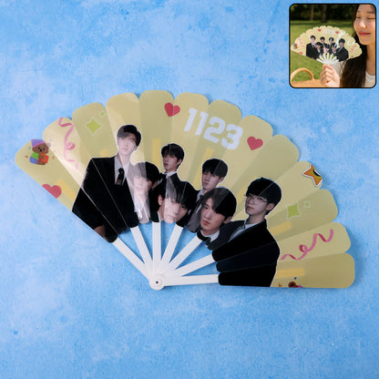Wukusy idol-themed foldable hand fan with colorful design, compact and lightweight for home improvement or decorative use.