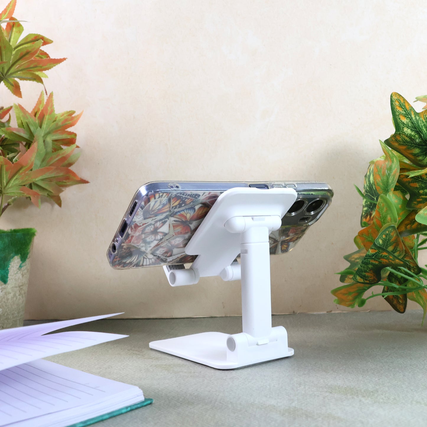 Wukusy adjustable foldable desktop mobile stand holding a smartphone, portable and lightweight for easy viewing.