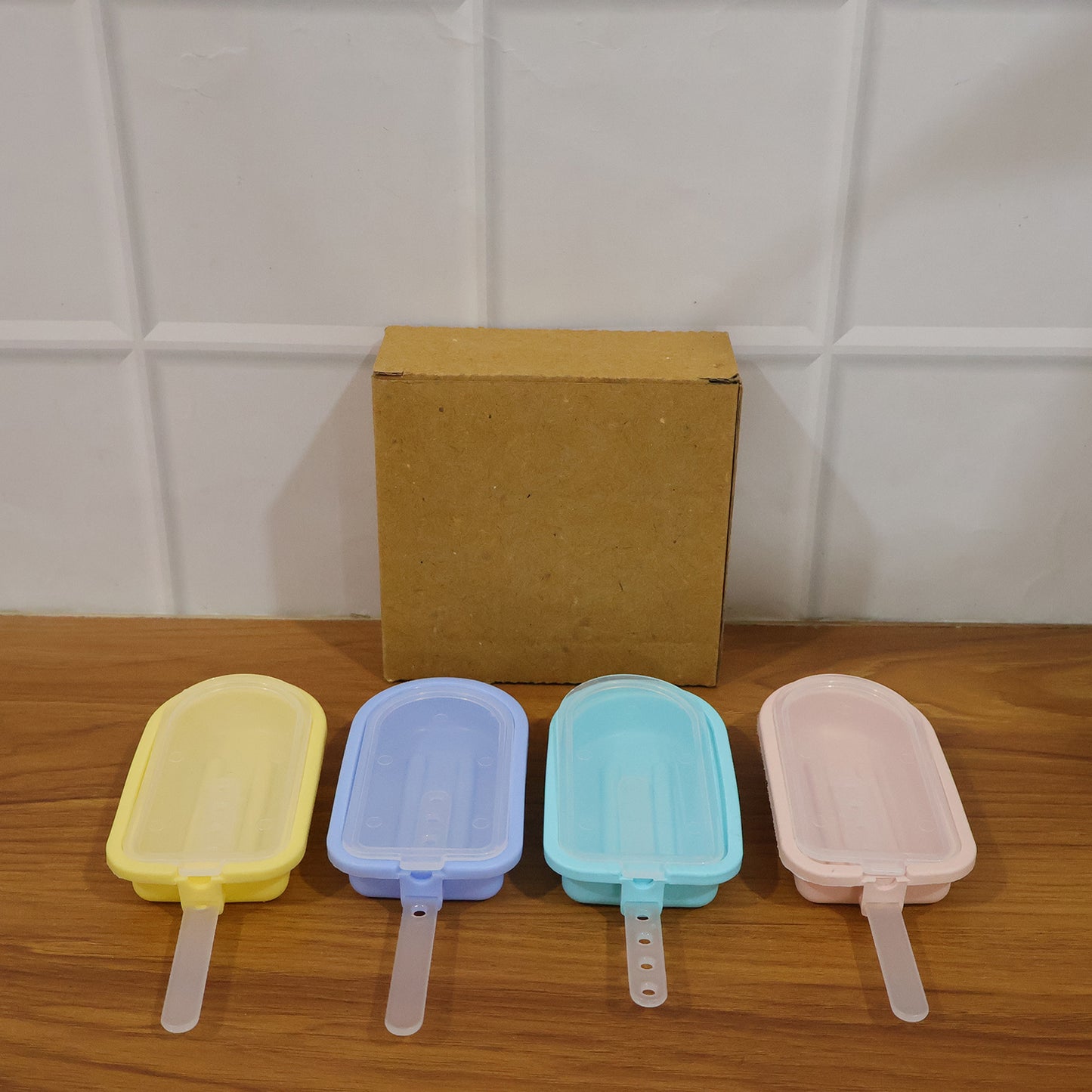 Wukusy premium silicone ice cream popsicle mold set with four colorful reusable molds for homemade frozen treats.