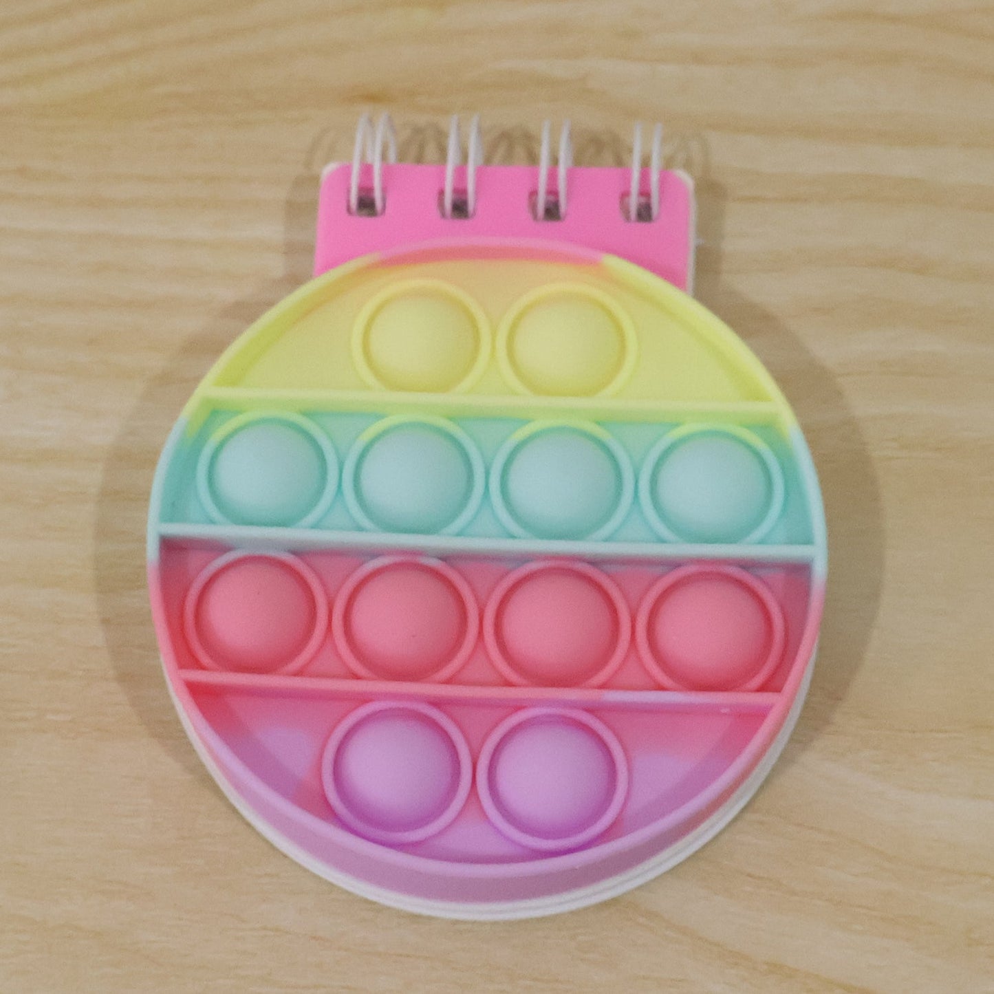 Wukusy Mini Pop It Diary fidget notebook for kids featuring rainbow silicone bubble popper and colorful cover.