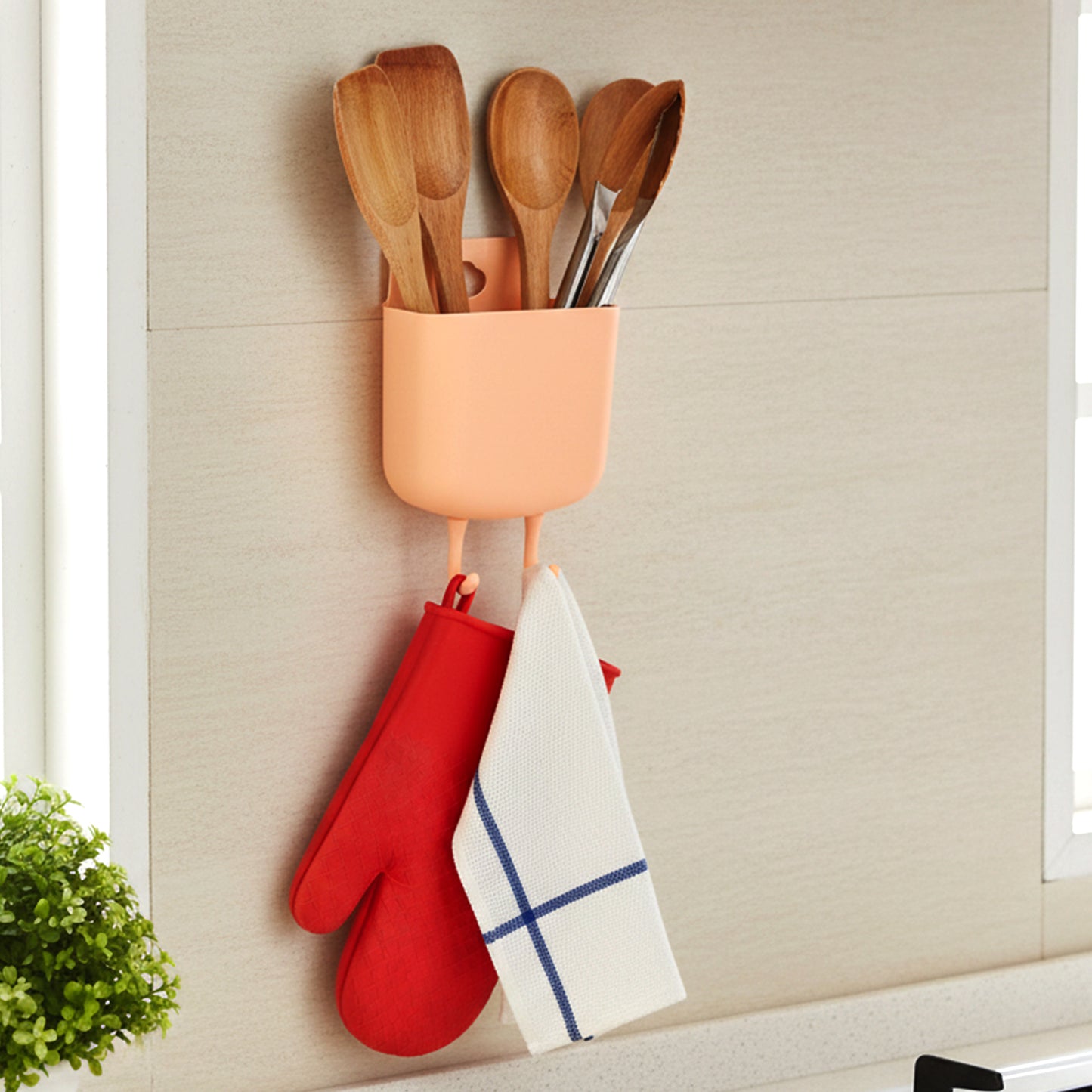 Wukusy multi-purpose plastic wall-mounted mobile charging holder with slots for smartphones and accessories.