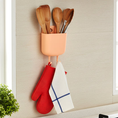 Wukusy multi-purpose plastic wall-mounted mobile charging holder with slots for smartphones and accessories.