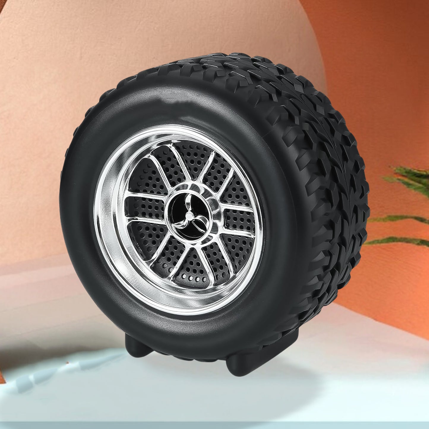 Wukusy portable tyre-shaped wireless Bluetooth speaker with wheel design, compact mobile accessory for portable music listening.