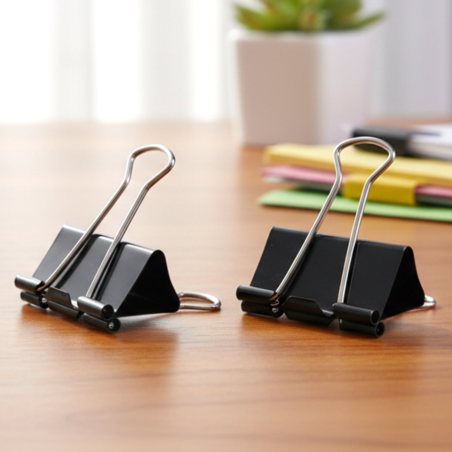 Set of 12 black metal binder clips, 19 mm size, by Wukusy, with open clips showing sturdy metal construction.