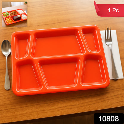 Red plastic multi-compartment rectangular meal serving tray from Wukusy, ideal for home and kitchen use, with several sections for different foods.