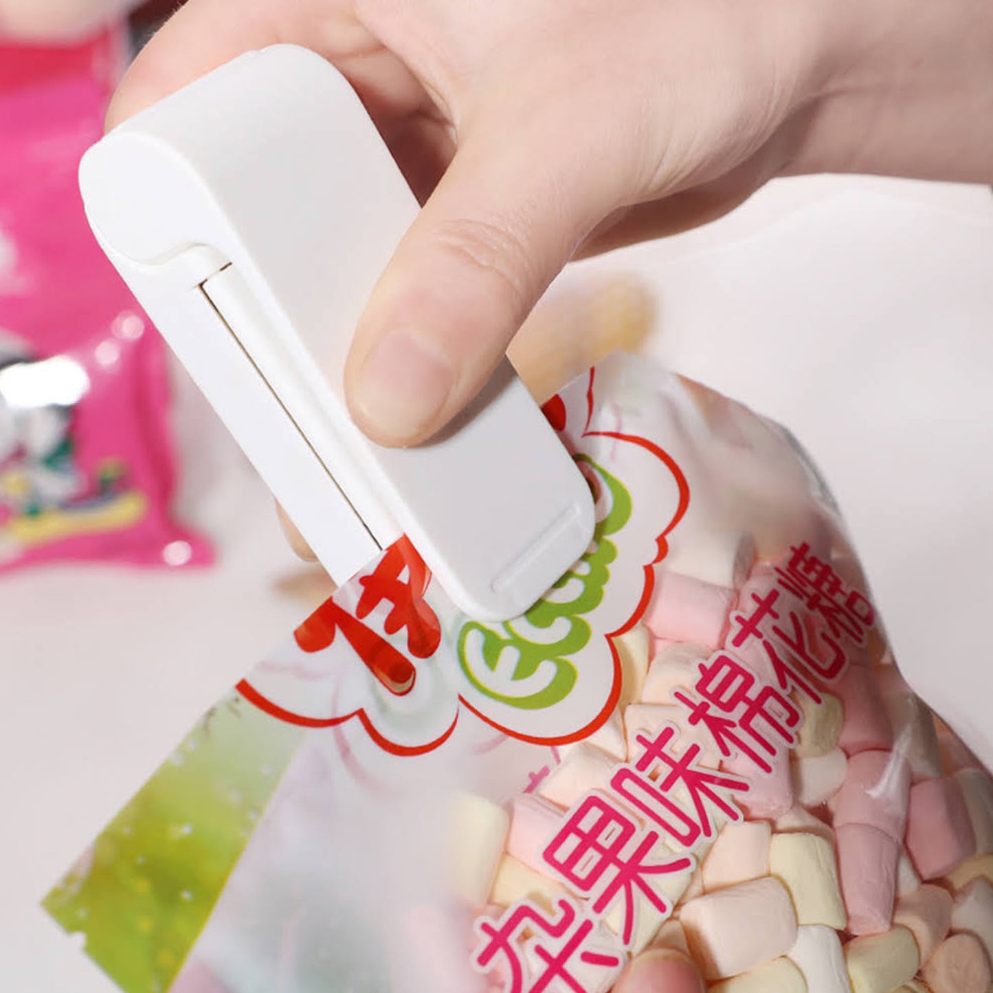 Wukusy mini plastic bag sealing machine, portable handheld heat sealer for sealing plastic bags in home improvement tasks.
