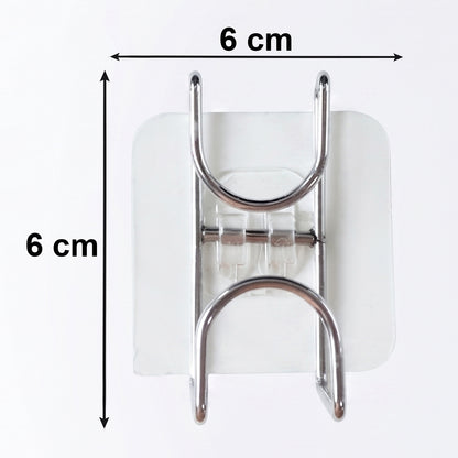 Transparent double loop adhesive wall hook by Wukusy, showing a clear plastic hook with adhesive backing on a wall.