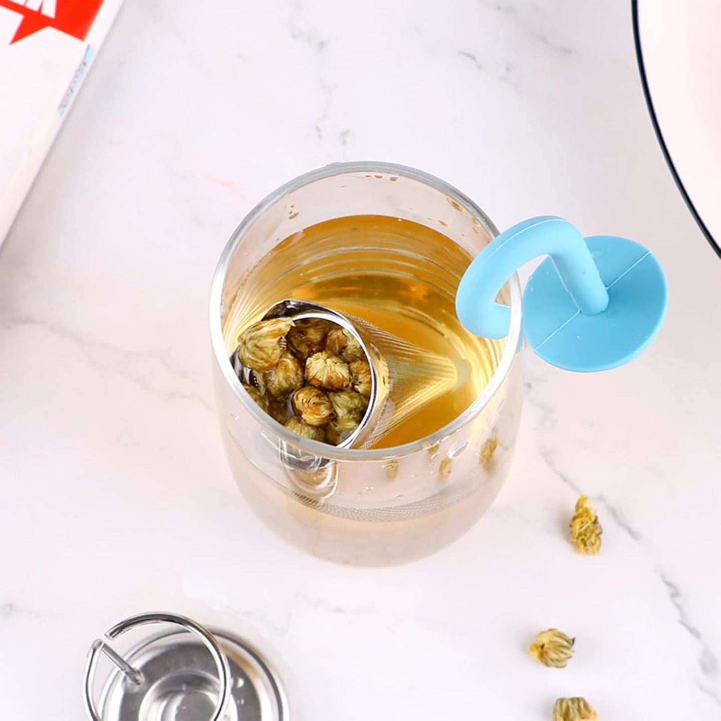 Colorful reusable Wukusy umbrella tea strainer without tray, compact and cute kitchen accessory for brewing tea.