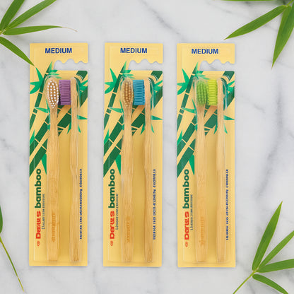 Wukusy eco-friendly bamboo toothbrush twin pack with 24 toothbrushes, natural bamboo handles and soft bristle heads.