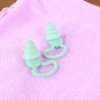 Wukusy premium layered silicone noise reduction earplugs for health care, showing a pair of soft, flexible earplugs in a close-up shot.