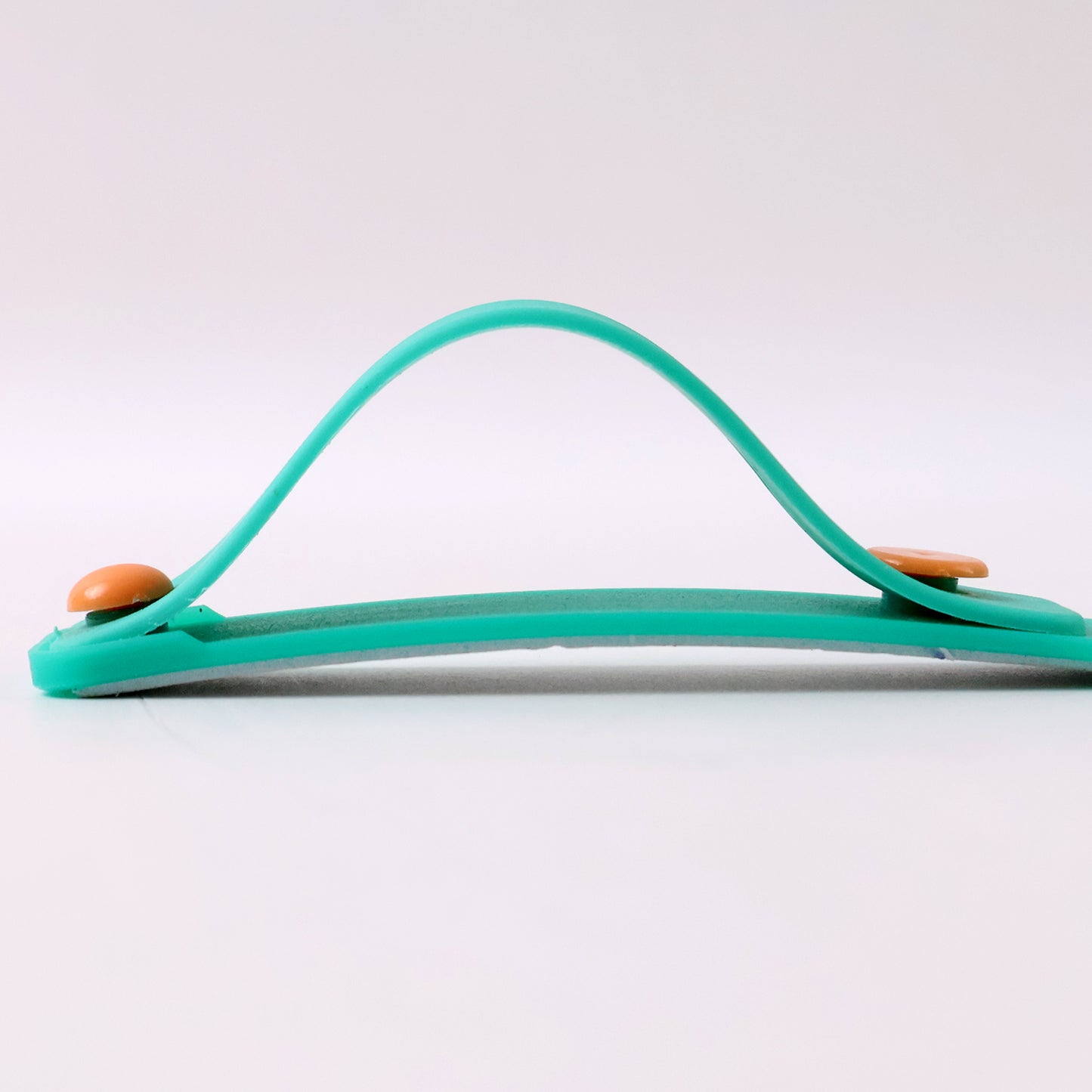 Teal green silicone phone grip strap with finger holder by Wukusy, designed for secure phone handling and easy grip.