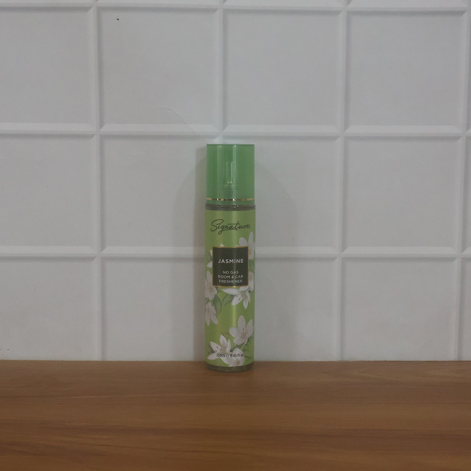 Wukusy Signature Jasmine Room Car Freshener Spray 250ml bottle with jasmine scent and sleek design on a car interior background