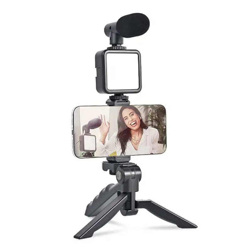 Ekom vlogging kit with mini tripod, LED light, phone holder clip, and microphone for video making and content creation.