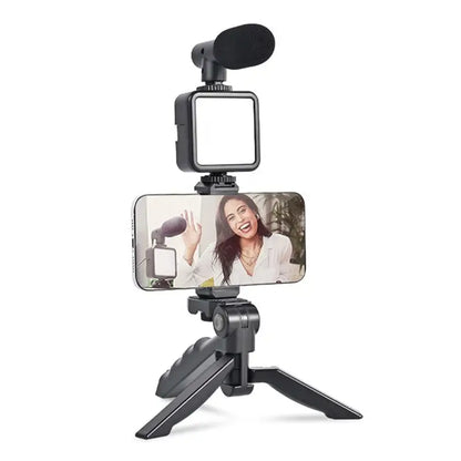 Ekom vlogging kit with mini tripod, LED light, phone holder clip, and microphone for video making and content creation.