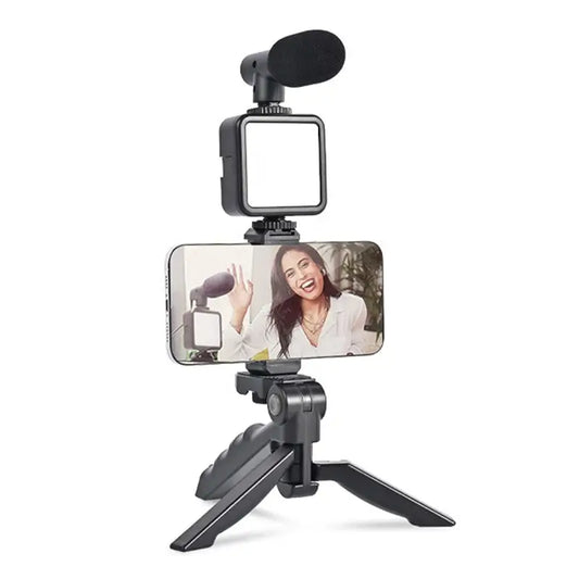 Ekom vlogging kit with mini tripod, LED light, phone holder clip, and microphone for video making and content creation.