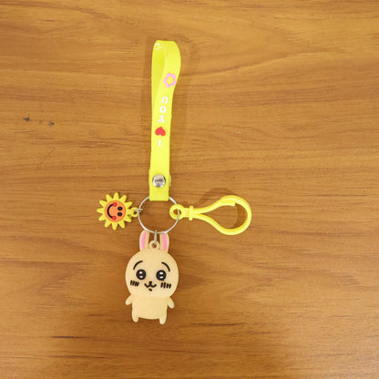 Cute cartoon bunny silicone keychain with decorative strap featuring Wukusy branding, displayed with vibrant colors and detailed design.