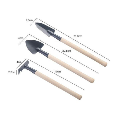 Kids garden tools set by Wukusy, includes a trowel, shovel, and rake, perfect for outdoor play and gardening fun.
