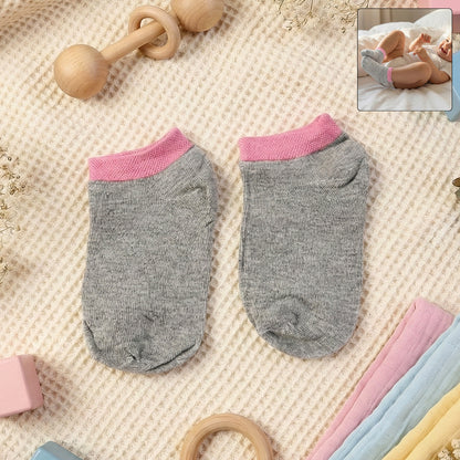 Pair of Wukusy premium soft light socks for small kids, comfortable and gentle for children's health and everyday wear.