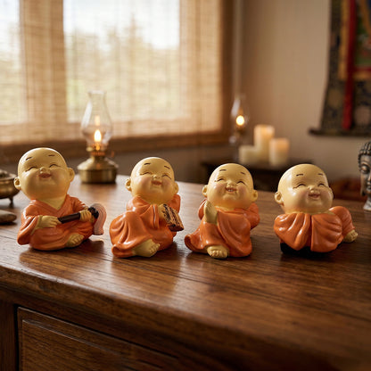Set of eight miniature Monk Buddha idols by Wukusy, featuring detailed, serene Buddha figures in a compact display.
