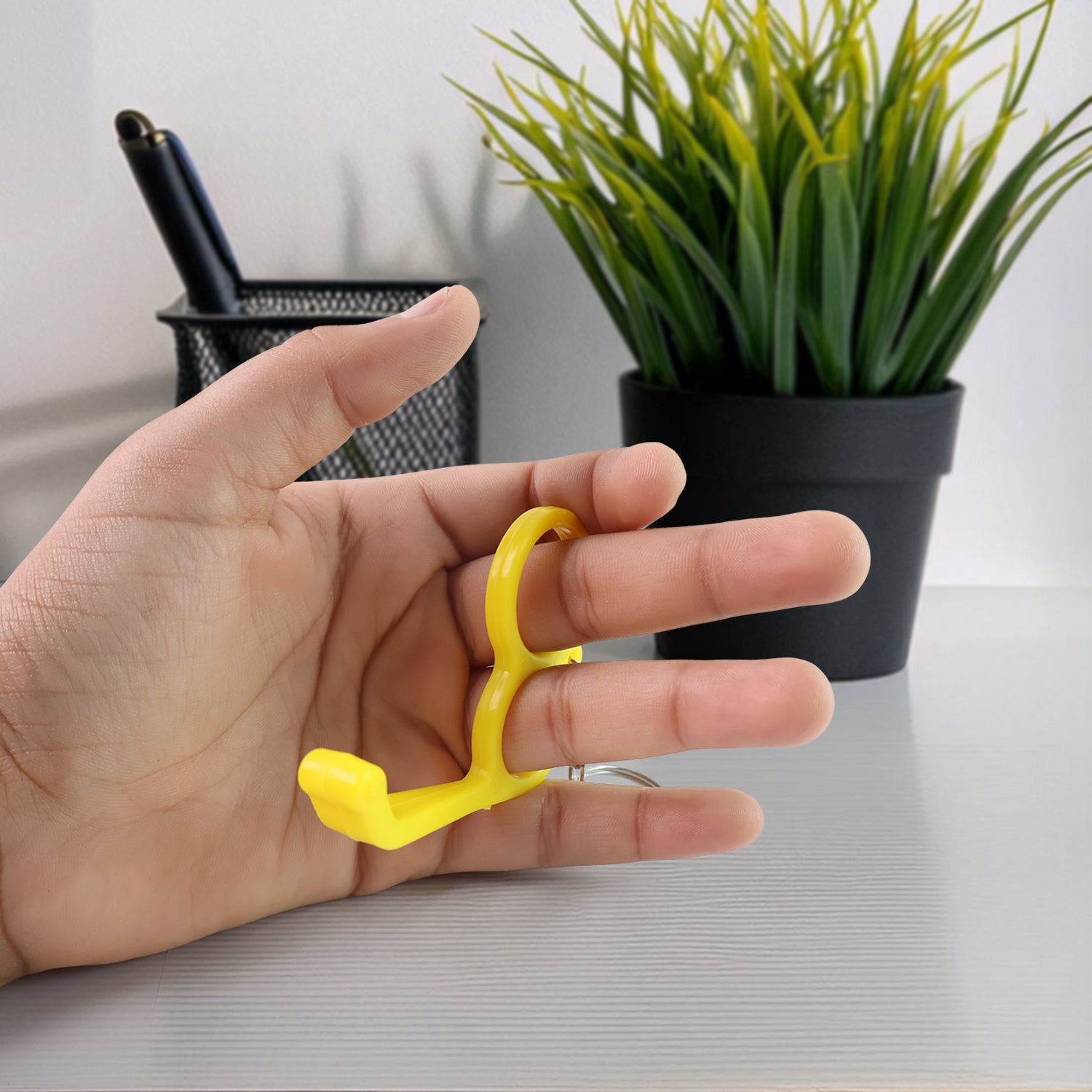 Wukusy 2-in-1 plastic dual-finger mobile stand and keyring in mixed colors, a versatile mobile accessory for grip and keys.