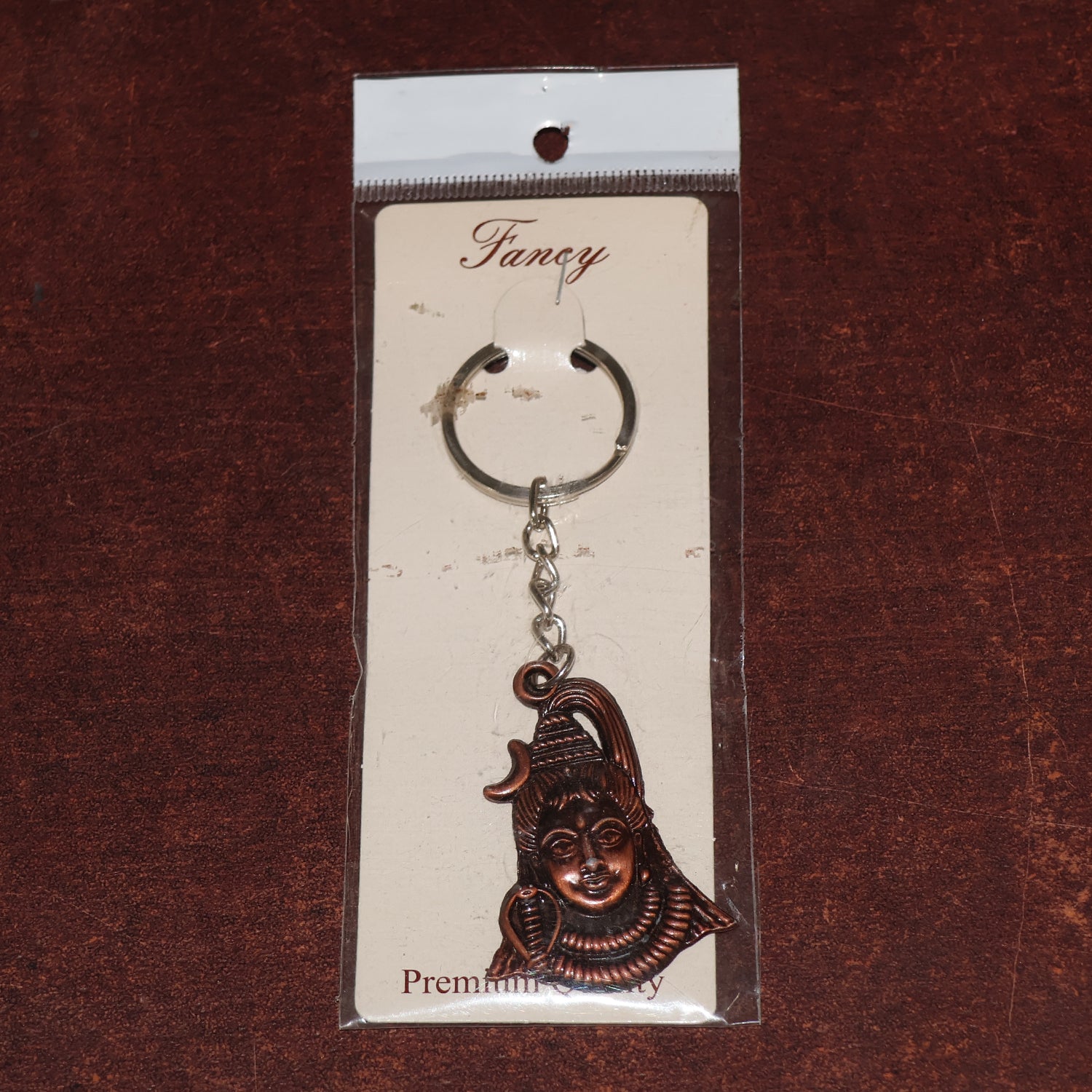 Antique finish Lord Shiva face keychain by Wukusy, showcasing detailed craftsmanship and traditional design.
