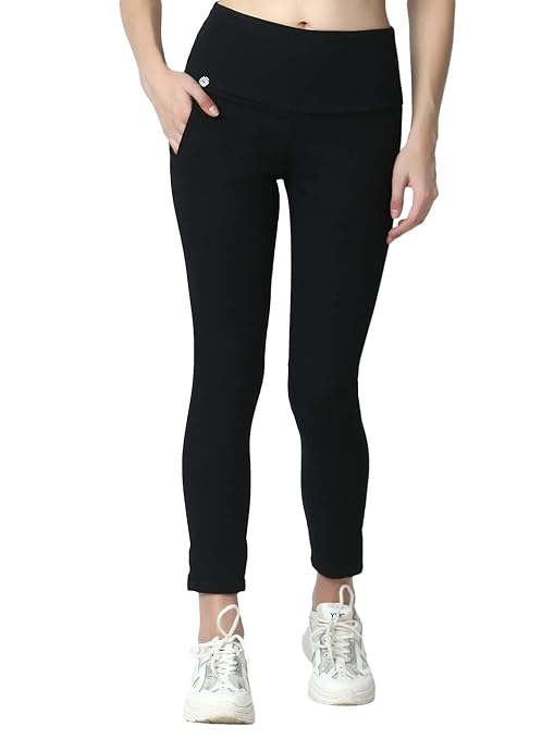 Black skinny fit high waist ankle-length jeggings from FIZZI SHOP, showing a close-up of the fitted design and stretchy fabric.